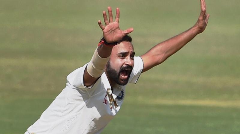 Indian bowler Amit Mishra appeals for the wicket of England batsman Zafar Ansari on the second day of the first Test match in Rajkot on Thursday (Photo: AP) Indian bowler Amit Mishra appeals for the wicket of England batsman Zafar Ansari on the second day of the first Test match in Rajkot on Thursday (Photo: AP)