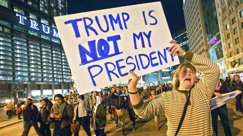 Demonstrators protest outside of the Trump Tower on Wednesday in Chicago, Illinois. Thousands of people across the United States took to the streets in protest a day after Republican Donald Trump was elected president, defeating Democrat Hillary Clinton. (Photo: AFP) Demonstrators protest outside of the Trump Tower on Wednesday in Chicago, Illinois. Thousands of people across the United States took to the streets in protest a day after Republican Donald Trump was elected president, defeating Democrat Hillary Clinton. (Photo: AFP)