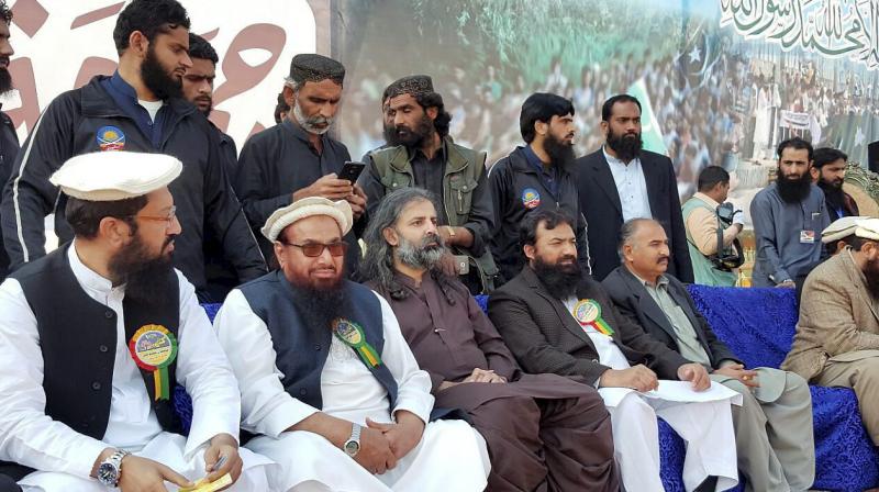 Jamaat-ud-Dawah (JuD) chief and Mumbai terror attack mastermind, Hafiz Saeed along with others at Kashmir Conference rally in Faisalabad, Pakistan. (Photo: PTI) Jamaat-ud-Dawah (JuD) chief and Mumbai terror attack mastermind, Hafiz Saeed along with others at Kashmir Conference rally in Faisalabad, Pakistan. (Photo: PTI)