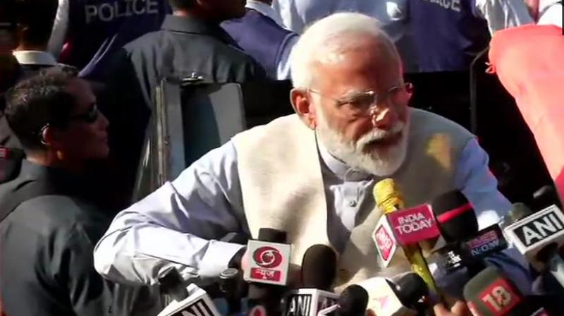 After casting his vote, Modi walked some distance from the polling booth and later had a brief interaction with media persons. (Photo: ANI | Twitter) After casting his vote, Modi walked some distance from the polling booth and later had a brief interaction with media persons. (Photo: ANI | Twitter)