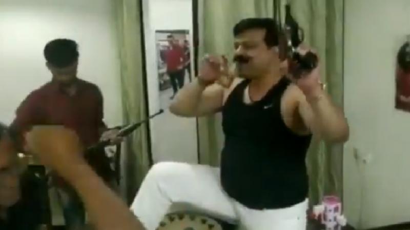 The video showed Champion dancing with more than two pistols and an automatic rifle. (Photo: Screengrab) The video showed Champion dancing with more than two pistols and an automatic rifle. (Photo: Screengrab)
