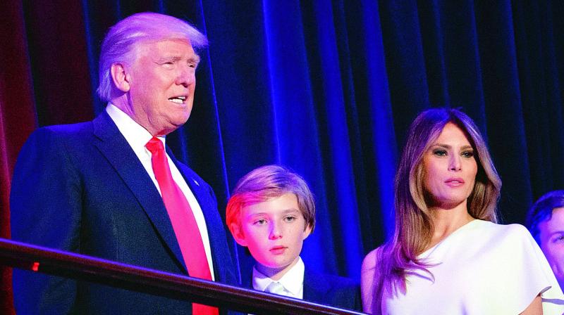 File photo of President-elect Donald Trump, left, arrives to speak at an election night rally with his son Barron and wife Melania, in New York. (Photo: AP) File photo of President-elect Donald Trump, left, arrives to speak at an election night rally with his son Barron and wife Melania, in New York. (Photo: AP)