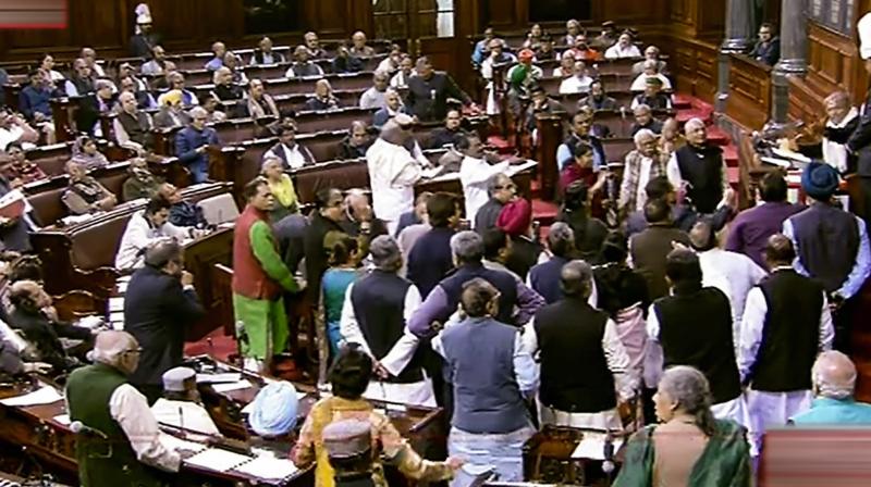 Opposition members protest in Rajya Sabha during Winter Session of Parliament. (Photo: RSTV grab via PTI) Opposition members protest in Rajya Sabha during Winter Session of Parliament. (Photo: RSTV grab via PTI)