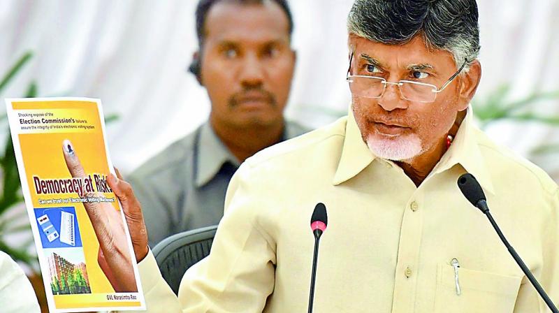Chief Minister N. Chandrababu Naidu addresses the media conference and shows the Democracy at Risk book by G.V.L. Narasimha Rao, at Praja Vedika on Monday. (DC) Chief Minister N. Chandrababu Naidu addresses the media conference and shows the Democracy at Risk book by G.V.L. Narasimha Rao, at Praja Vedika on Monday. (DC)