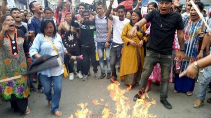 Gorkha Janmukti Morcha (GJM) supporters during their protest in Darjeeling on Thursday. (Photo: PTI) Gorkha Janmukti Morcha (GJM) supporters during their protest in Darjeeling on Thursday. (Photo: PTI)