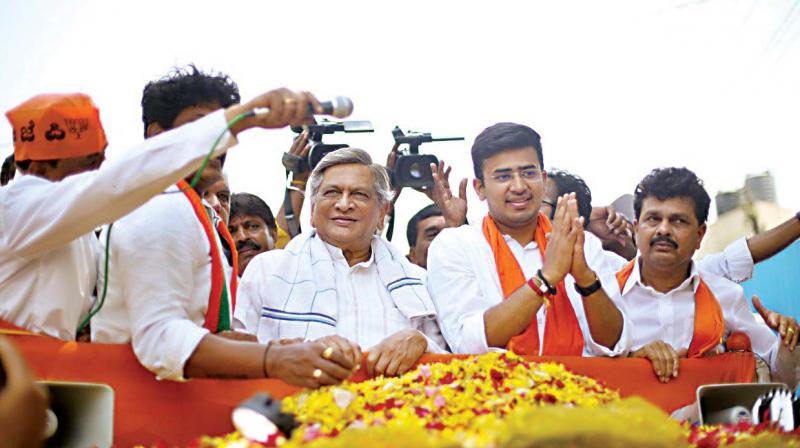 BJP candidate Tejasvi Surya campains with former CM S.M. Krishna on Friday BJP candidate Tejasvi Surya campains with former CM S.M. Krishna on Friday