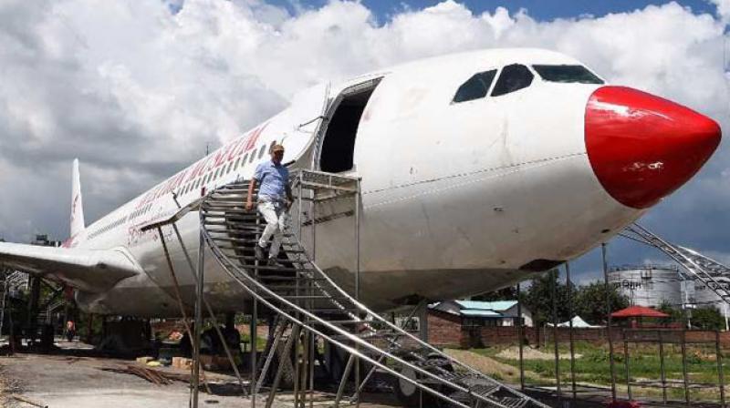 pilot Bed Upreti bought the metal carcass and has invested $600,000 to turn it into an aviation museum. (Photo: AFP) pilot Bed Upreti bought the metal carcass and has invested $600,000 to turn it into an aviation museum. (Photo: AFP)