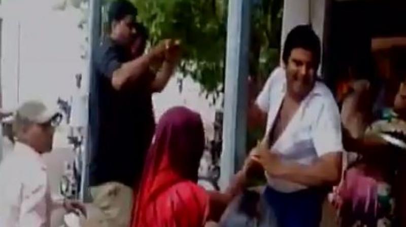 A lawyer in Madhya Pradesh's Guna was beaten up by a group of women for allegedly making sexual advances towards women. (Photo: Videograb) A lawyer in Madhya Pradesh's Guna was beaten up by a group of women for allegedly making sexual advances towards women. (Photo: Videograb)