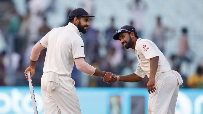 Virat Kohli was the non-playing captain on the day, carrying drinks during one of the breaks, while Ajinkya Rahane led the team in a Mahendra singh Dhoni-esque manner. (Photo: AP) Virat Kohli was the non-playing captain on the day, carrying drinks during one of the breaks, while Ajinkya Rahane led the team in a Mahendra singh Dhoni-esque manner. (Photo: AP)