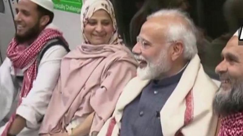 Prime Minister Narendra Modi taking a Metro ride in Delhi on Tuesday. (Photo: ANI) Prime Minister Narendra Modi taking a Metro ride in Delhi on Tuesday. (Photo: ANI)
