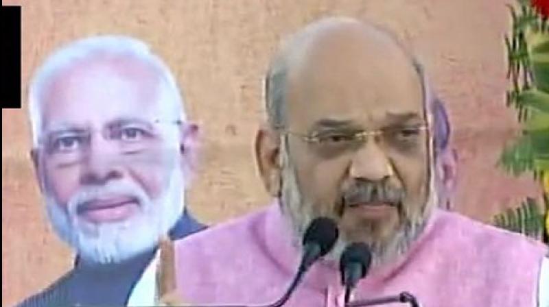 BJP president Amit Shah addressing a rally in Gazipur on Tuesday. (Photo: ANI) BJP president Amit Shah addressing a rally in Gazipur on Tuesday. (Photo: ANI)