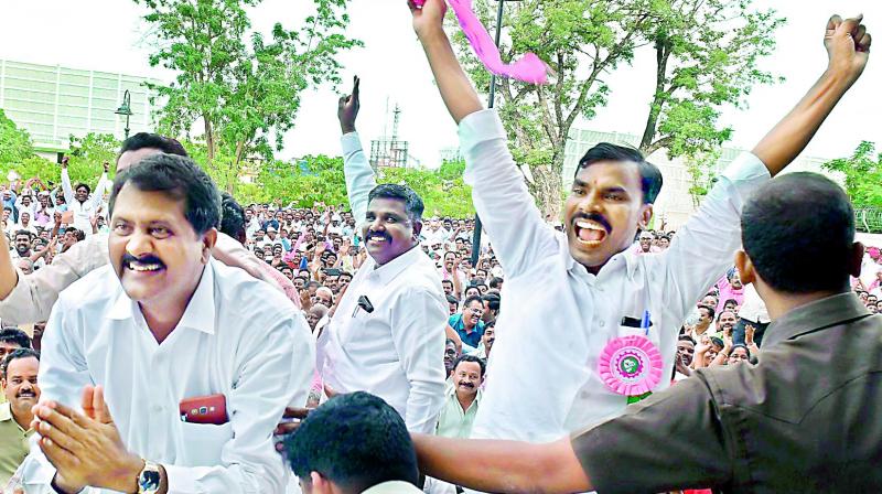 Employees of power companies cheer as Chief Minister K. Chandrasekhar Rao announces sops for them at a meeting organised in Pragathi Bhavan in Hyderabad on Saturday. Employees of power companies cheer as Chief Minister K. Chandrasekhar Rao announces sops for them at a meeting organised in Pragathi Bhavan in Hyderabad on Saturday.