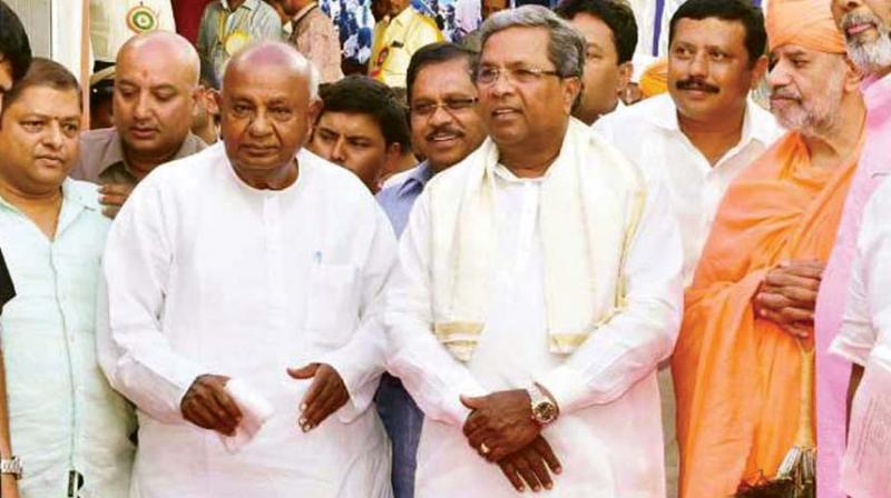 JD(S) supremo Deve Gowda and former CM Siddaramaiah in a file photo JD(S) supremo Deve Gowda and former CM Siddaramaiah in a file photo