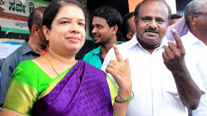 Chief Minister H.D. Kumaraswamy and wife Anita after voting in a recent poll Chief Minister H.D. Kumaraswamy and wife Anita after voting in a recent poll
