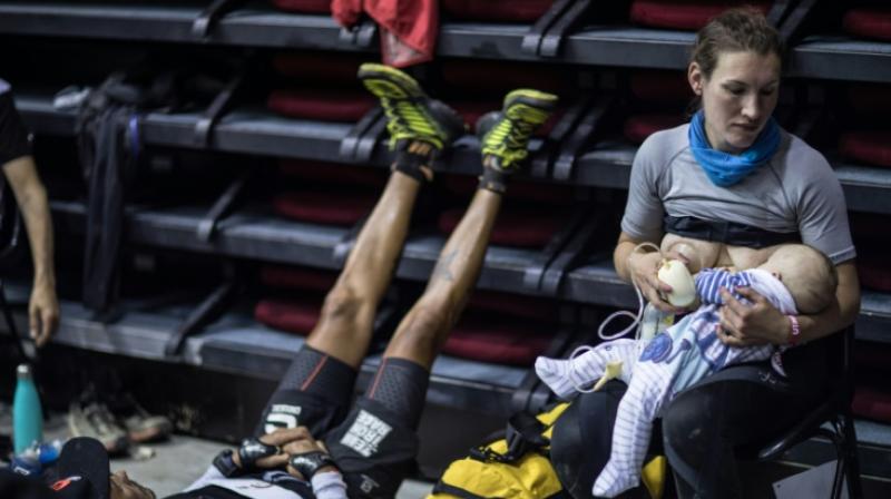 Great-Britain's trail runner Sophie Power breastfeeds her three months old baby Cormac. (Photo: AFP) Great-Britain's trail runner Sophie Power breastfeeds her three months old baby Cormac. (Photo: AFP)