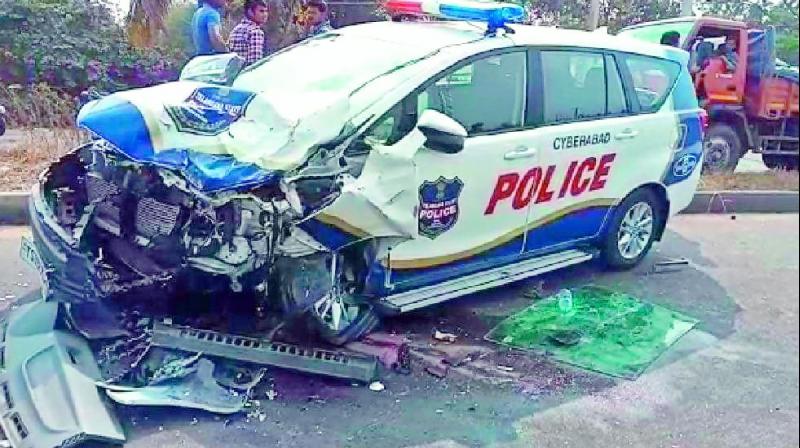The damaged police patrol car lies in the middle of the road after the accident. The damaged police patrol car lies in the middle of the road after the accident.