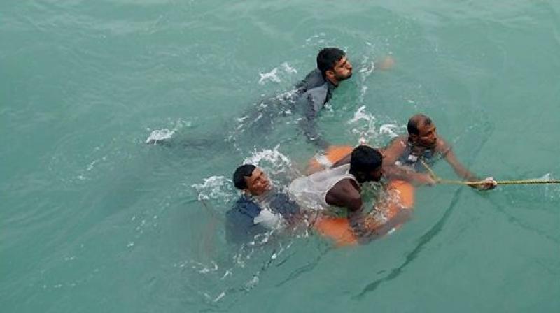 Bangladeshi nationals, who were found adrift at sea over 100 miles away from Bangladeshi city of Chittagong due to Cyclone Mora, were rescued by the Indian Navy on Wednesday. (Photo: PTI) Bangladeshi nationals, who were found adrift at sea over 100 miles away from Bangladeshi city of Chittagong due to Cyclone Mora, were rescued by the Indian Navy on Wednesday. (Photo: PTI)
