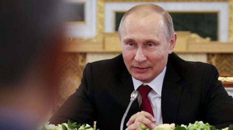 Russian President Vladimir Putin (R) (Photo: AP) Russian President Vladimir Putin (R) (Photo: AP)