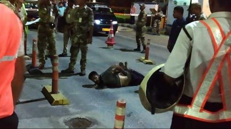 The man was pinned down on the road and tied with ropes. (Photo: Twitter | ANI) The man was pinned down on the road and tied with ropes. (Photo: Twitter | ANI)