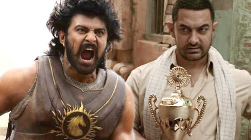 Prabhas in a still from 'Baahubali', Aamir Khan in 'Dangal.' Prabhas in a still from 'Baahubali', Aamir Khan in 'Dangal.'