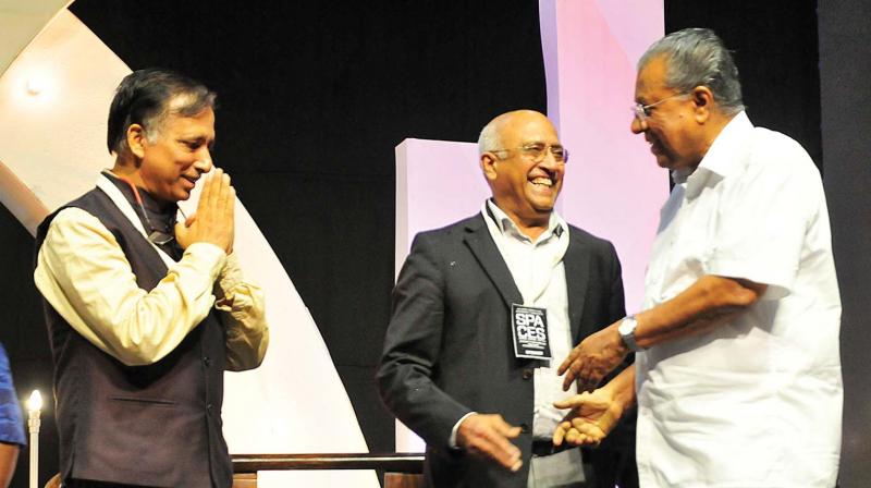 Chief Minister Pinarayi Vijayan greets cosmonaut Rakesh Sharma (centre) and Council of Architecture president Vijay Garg at the space fest held at Nishagandhi Auditorium in Thiruvanananthapuram on Thursday. (DC) Chief Minister Pinarayi Vijayan greets cosmonaut Rakesh Sharma (centre) and Council of Architecture president Vijay Garg at the space fest held at Nishagandhi Auditorium in Thiruvanananthapuram on Thursday. (DC)