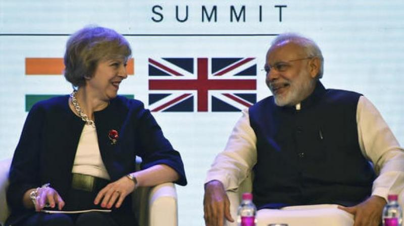 A file photo of British PM Theresa May with Indian PM Narendra Modi. (Photo: PTI) A file photo of British PM Theresa May with Indian PM Narendra Modi. (Photo: PTI)