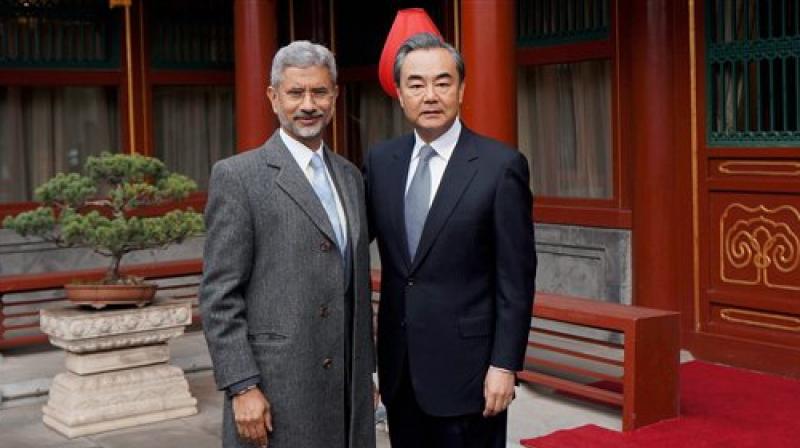 Foreign Secretary, S. Jaishankar with Chinese Foreign Minister Wang Yi before a meeting in Beijing on Wednesday. (Photo: PTI) Foreign Secretary, S. Jaishankar with Chinese Foreign Minister Wang Yi before a meeting in Beijing on Wednesday. (Photo: PTI)