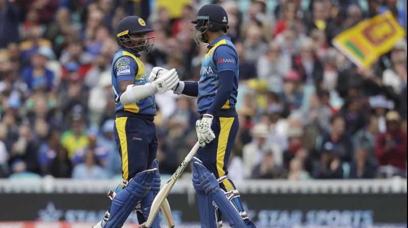 Dimuth Karunaratne and Kusal Perera both hit half-centuries in a swashbuckling opening partnership of 115 before Perera was bowled by Mitchell Starc. (Photo: AP) Dimuth Karunaratne and Kusal Perera both hit half-centuries in a swashbuckling opening partnership of 115 before Perera was bowled by Mitchell Starc. (Photo: AP)