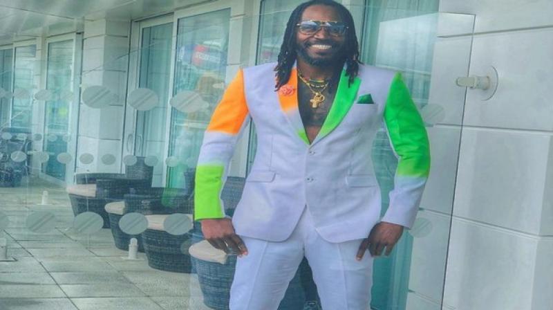 Gayle shared a picture of himself donning a white suit with patches of orange and green with a grey patch in between on one side of the outfit (Photo: Cricket World Cup/ Twitter) Gayle shared a picture of himself donning a white suit with patches of orange and green with a grey patch in between on one side of the outfit (Photo: Cricket World Cup/ Twitter)