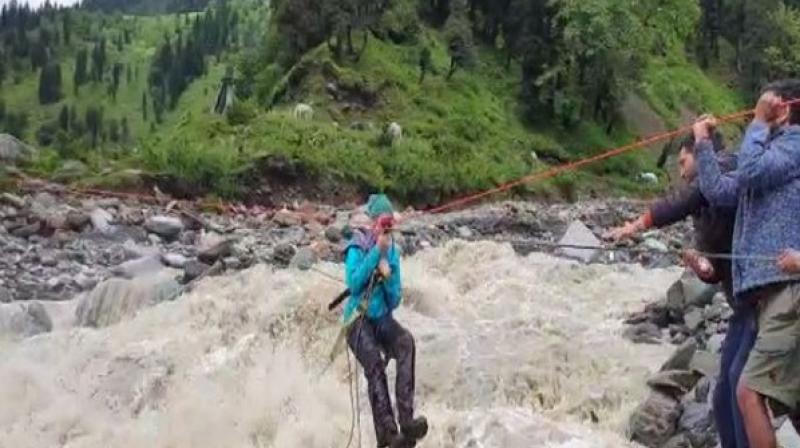 Heavy rainfall in Kullu district has brought life to a standstill. Around 60 roads across the district were blocked by landslides. Road clearing operations are being carried out by the administration. (Photo: ANI) Heavy rainfall in Kullu district has brought life to a standstill. Around 60 roads across the district were blocked by landslides. Road clearing operations are being carried out by the administration. (Photo: ANI)