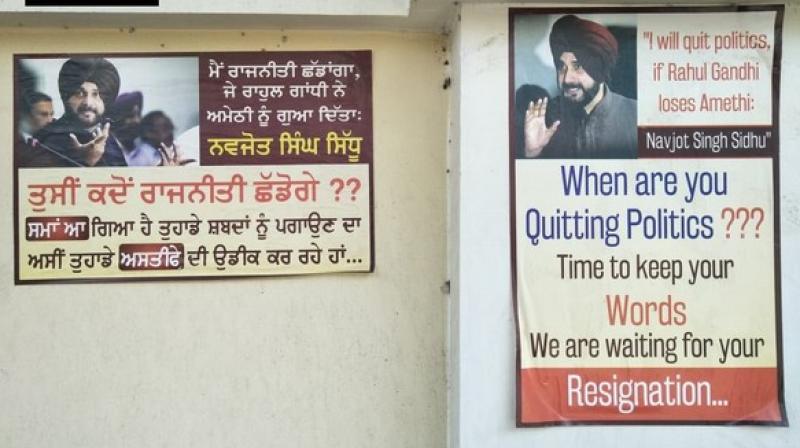 The posters carried Sidhu's promise, 'I will quit politics if Rahul Gandhi loses from Amethi,' the Congress leader had in one of his campaign rallies. (Photo: ANI) The posters carried Sidhu's promise, 'I will quit politics if Rahul Gandhi loses from Amethi,' the Congress leader had in one of his campaign rallies. (Photo: ANI)