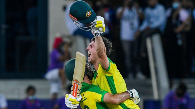 Australias Glenn Maxwell (left) and Mitchell Marsh celebrate their win in the T20 World Cup final match against New Zealand in Dubai on Sunday. (Photo: AFP)