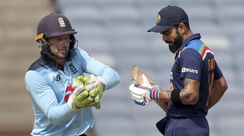 England wicketkeeper Jos Buttler (left) and Indias captain Virat Kohli in a file photo. (Photo: AP)
