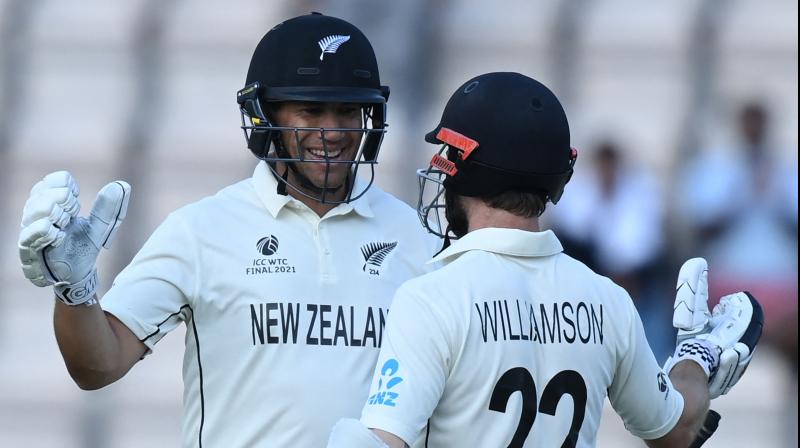 New Zealands Ross Taylor (L) and New Zealands captain Kane Williamson celebrate victory on the final day of the ICC World Test Championship Final between New Zealand and India at the Ageas Bowl in Southampton, southwest England on June 23, 2021. New Zealand beat India by 8 wickets. (Photo: AFP)