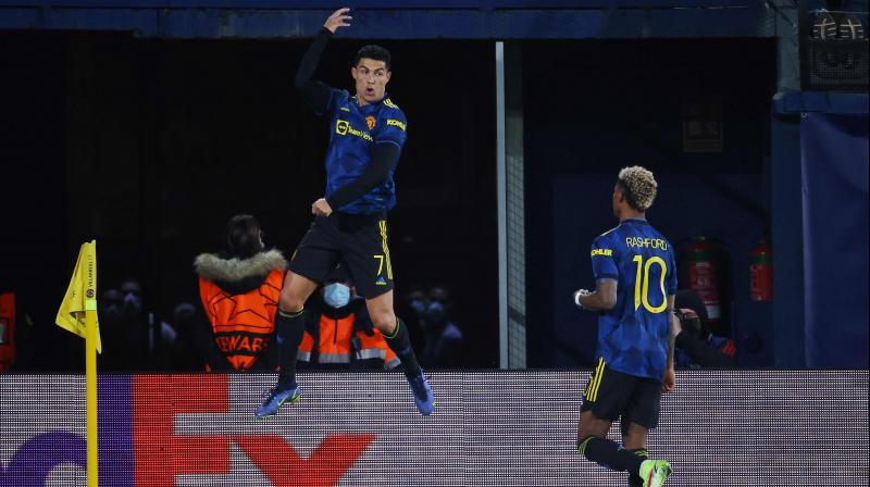 Manchester Uniteds Portuguese forward Cristiano Ronaldo (L) celebrates after scoring a goal during the UEFA Champions League Group F football match between Villarreal CF and Manchester United, at La Ceramica stadium in Vila-real on Wednesday morning. (Photo: AFP)