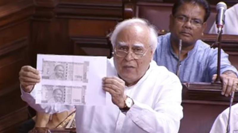 Kapil Sibal said different sizes of these notes were being printed – 'one for the ruling party (members) and one for the others'. (Photo: RSTV screengrab) Kapil Sibal said different sizes of these notes were being printed – 'one for the ruling party (members) and one for the others'. (Photo: RSTV screengrab)