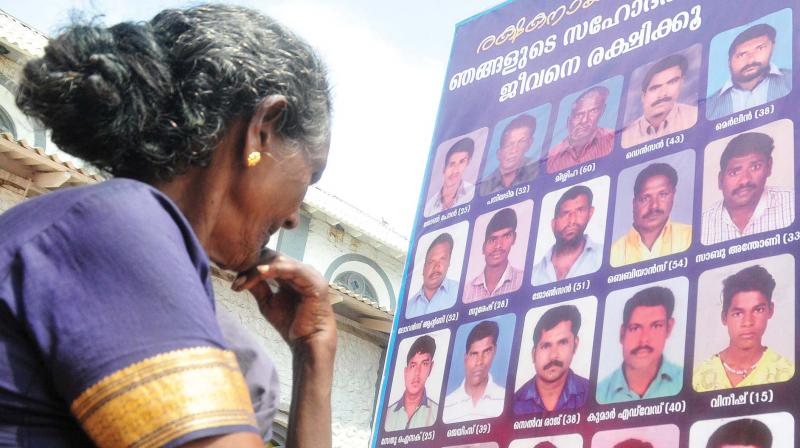 A flexboard in front of a church at Poonthura in Thiruvananthapuram displays photographs of missing fishermen on Thursday. (Photo: A.V. MUZAFAR) A flexboard in front of a church at Poonthura in Thiruvananthapuram displays photographs of missing fishermen on Thursday. (Photo: A.V. MUZAFAR)