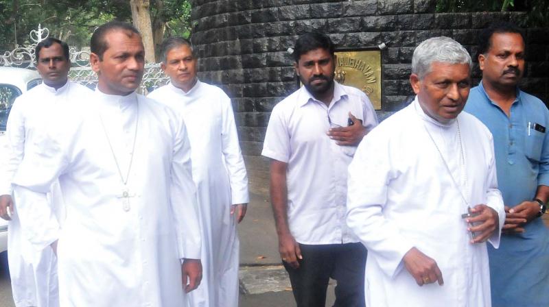 Latin Catholic Archbishop M. Soosapakiam, auxiliary bishop Christudas Rajappan and vicar-general Fr Eugene H. Pereira come out of Raj Bhavan after meeting governor P. Sathasivam on Tuesday. (Photo: A. V. Muzafar) Latin Catholic Archbishop M. Soosapakiam, auxiliary bishop Christudas Rajappan and vicar-general Fr Eugene H. Pereira come out of Raj Bhavan after meeting governor P. Sathasivam on Tuesday. (Photo: A. V. Muzafar)