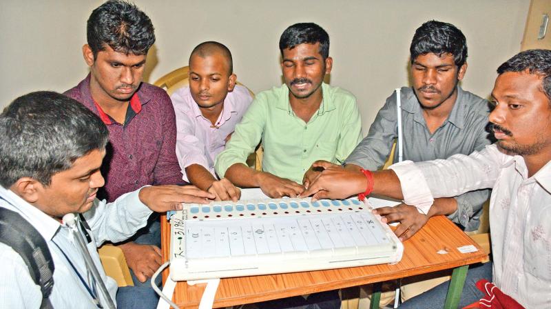 People with visual impairment at the Braile verification booth in RK Nagar on Friday. (Photo: DC) People with visual impairment at the Braile verification booth in RK Nagar on Friday. (Photo: DC)
