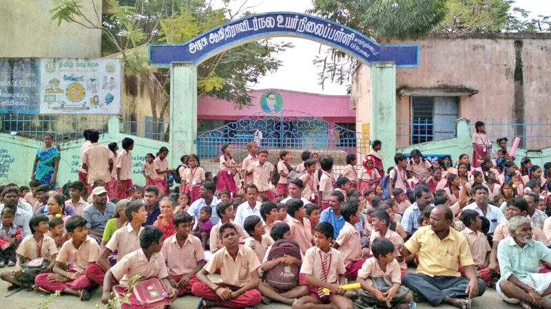 Students stage road roko outside Adi Dravida school. (Photo: DC) Students stage road roko outside Adi Dravida school. (Photo: DC)