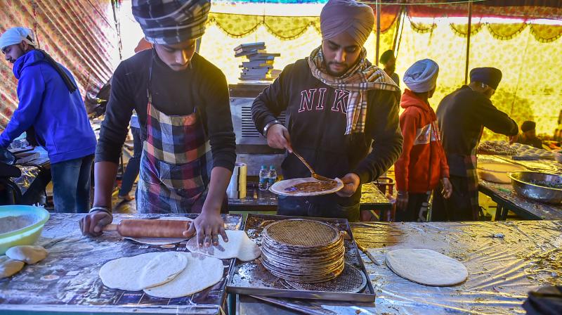 Langar being prepared for farmers during their ongoing protest against the new farm laws, at Singhu border in New Delhi, Sunday, January 10, 2021. (PTI/Arun Sharma)