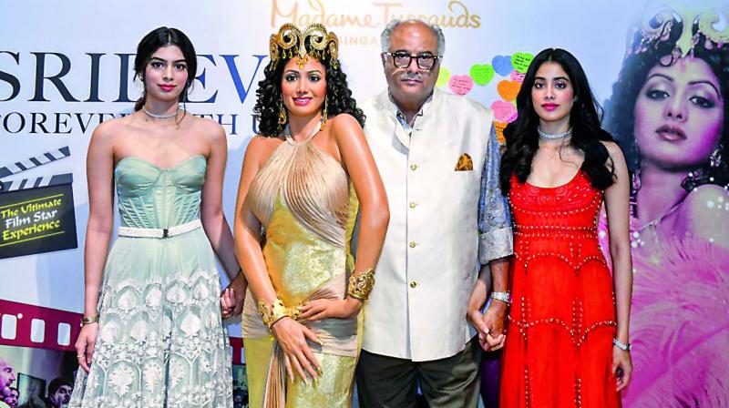 Boney, Janhvi, and Khushi Kapoor looked sombre at the unveiling of the Sridevi wax figure at Madame Tussauds in Singapore. Boney, Janhvi, and Khushi Kapoor looked sombre at the unveiling of the Sridevi wax figure at Madame Tussauds in Singapore.