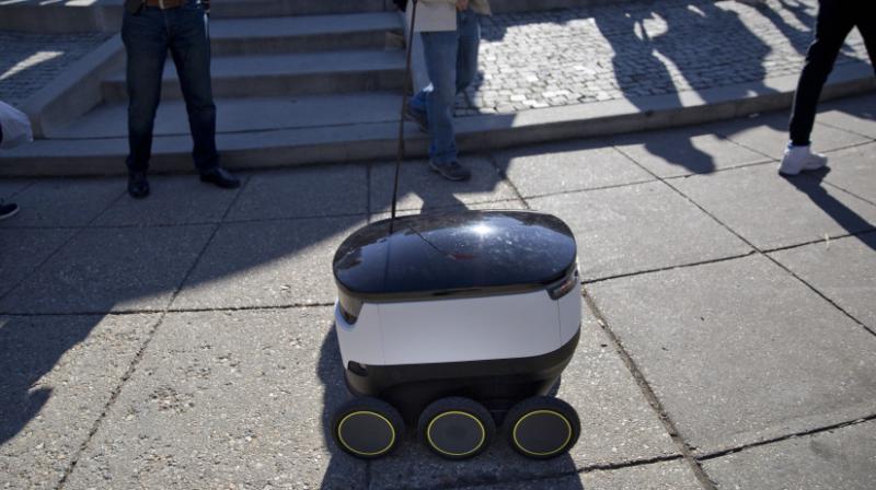 A six-wheeled ground delivery robot, from Starship Technologies, shares the sidewalk with pedestrians at DuPont Circle in Washington, D.C. Photo:AP A six-wheeled ground delivery robot, from Starship Technologies, shares the sidewalk with pedestrians at DuPont Circle in Washington, D.C. Photo:AP