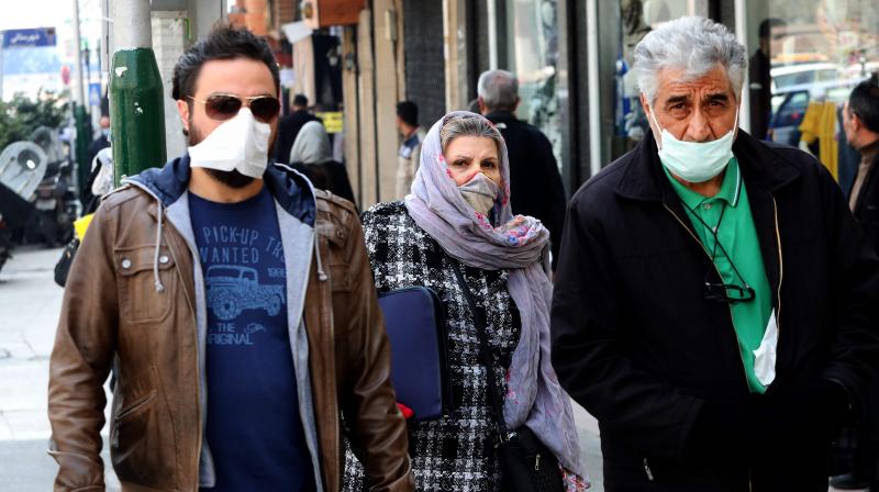 Mask-clad pedestrians walk through Tajrish Bazaar in the Iranian capital Tehran on February 29, 2020 (AFP) Mask-clad pedestrians walk through Tajrish Bazaar in the Iranian capital Tehran on February 29, 2020 (AFP)