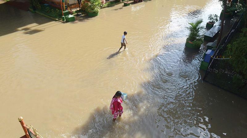 A waterlogged road at Anugraha Layout, Bilekahalli, due to heavy rainfall in the city, in Bengaluru on Sunday. (Photo: Shahsidhar b. & R. Samuel) A waterlogged road at Anugraha Layout, Bilekahalli, due to heavy rainfall in the city, in Bengaluru on Sunday. (Photo: Shahsidhar b. & R. Samuel)