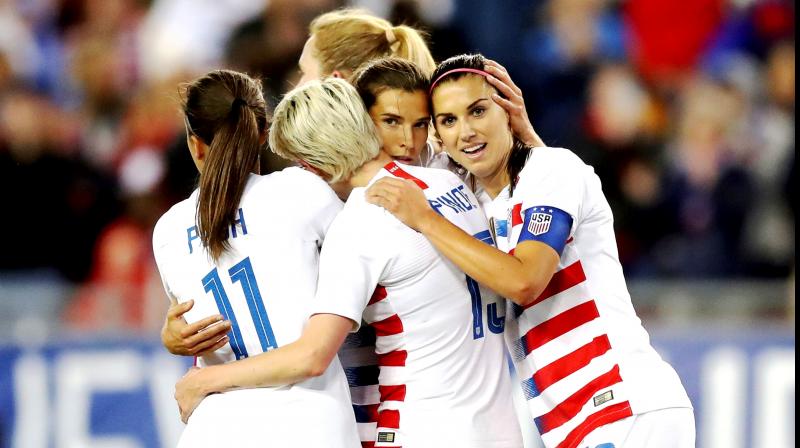 United States' Tobin Heath, second from right, is congratulated on her goal by Mallory Pugh, Megan Rapinoe and Alex Morgan during the first half of a SheBelieves Cup soccer match against Brazil in Tampa, Florida. United States' Tobin Heath, second from right, is congratulated on her goal by Mallory Pugh, Megan Rapinoe and Alex Morgan during the first half of a SheBelieves Cup soccer match against Brazil in Tampa, Florida.