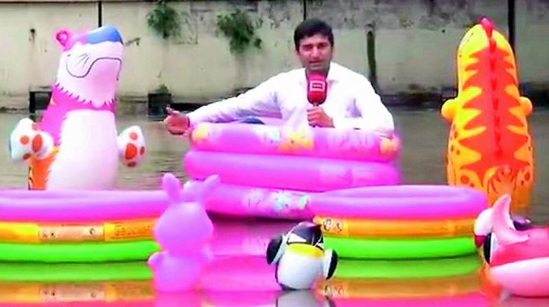 The Pakistan reporter told locals to do the same as water level would not recede soon. (Image: Screenshot) The Pakistan reporter told locals to do the same as water level would not recede soon. (Image: Screenshot)