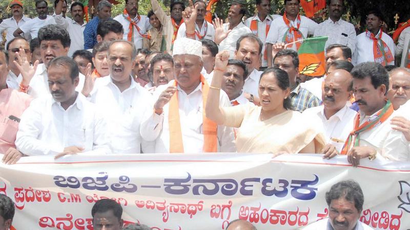 BJP members protest against KPCC working president Dinesh Gundurao’s remarks against UP Chief Minister Yogi Adityanath, in Bengaluru on Sunday (Image: KPN) BJP members protest against KPCC working president Dinesh Gundurao’s remarks against UP Chief Minister Yogi Adityanath, in Bengaluru on Sunday (Image: KPN)