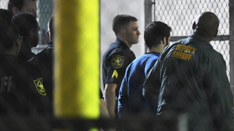 Esteban Santiago, 26, the suspect in the deadly shooting at Fort Lauderdale-Hollywood International Airport, is transported to the Broward County Main Jail by authorities. (Photo: AP) Esteban Santiago, 26, the suspect in the deadly shooting at Fort Lauderdale-Hollywood International Airport, is transported to the Broward County Main Jail by authorities. (Photo: AP)
