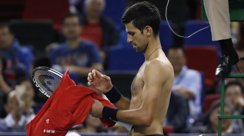 Djokovic hadn't played in a tournament since losing the U.S. Open final last month due to an elbow injury. (Photo: AP) Djokovic hadn't played in a tournament since losing the U.S. Open final last month due to an elbow injury. (Photo: AP)